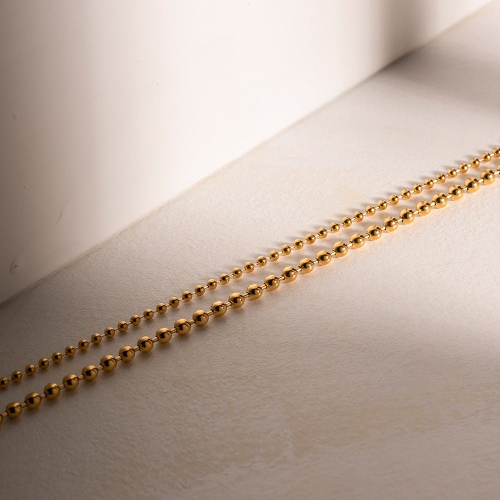 Collier en Chaîne à Boules Superposées